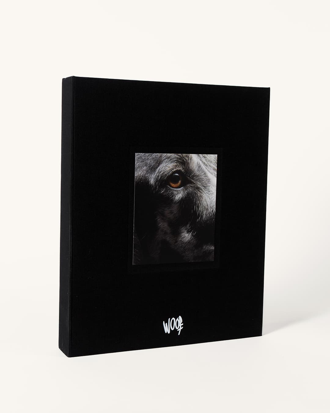 The WOOF clamshell at three-quarter angle, the HEALTHYCORDE editorial signature visible on the spine.
